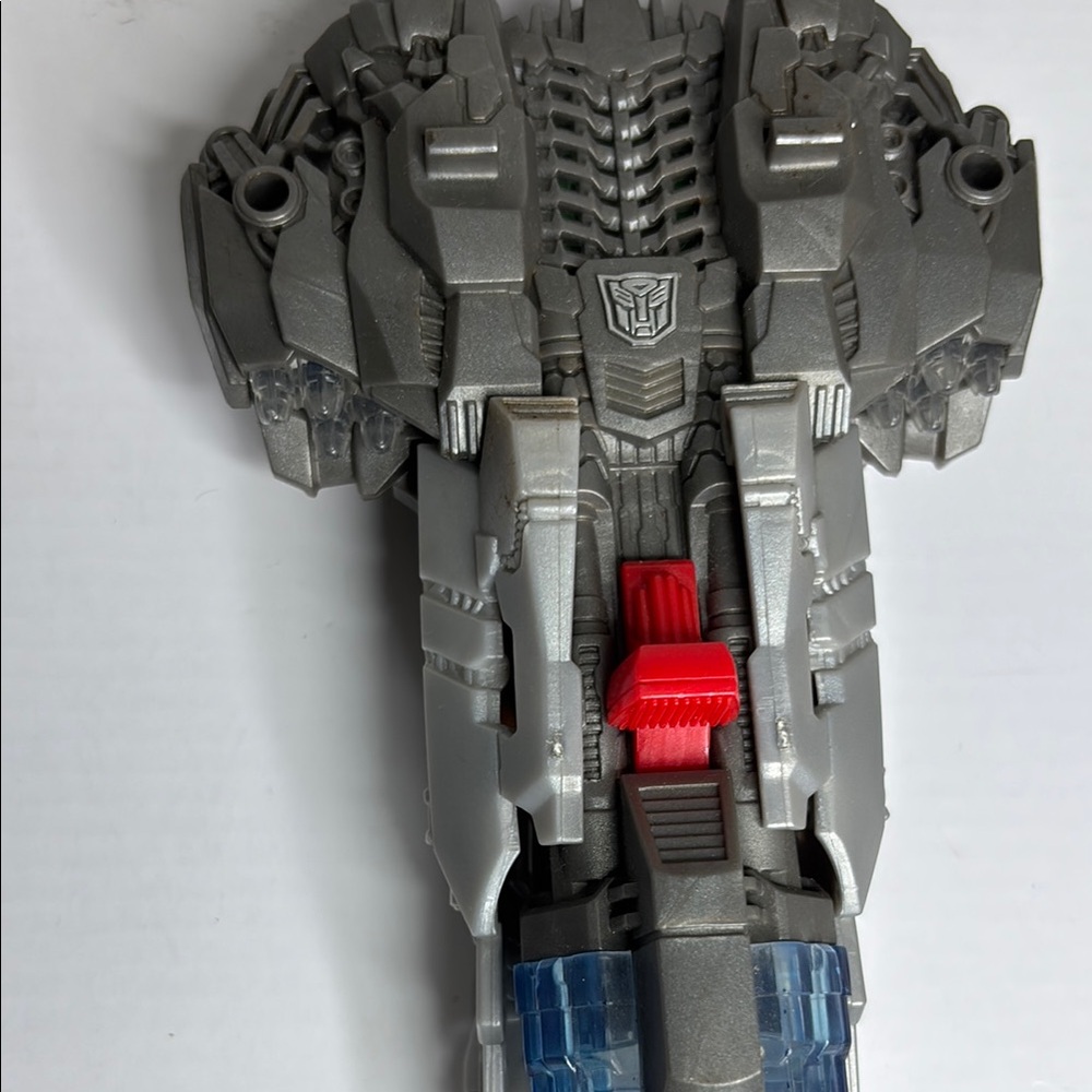 Silver and Red Transformer Toy